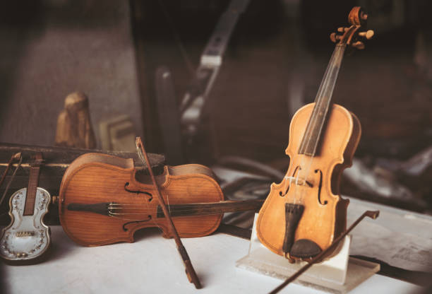 istock Old musical instruments, violins and cello 2021326387