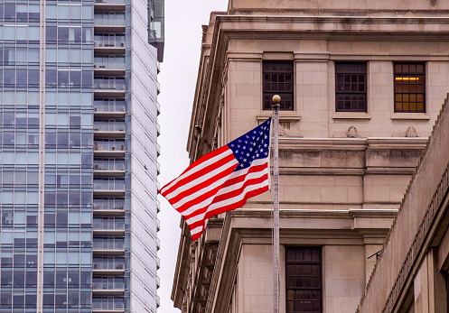 Flag of the United States waving on a mast.