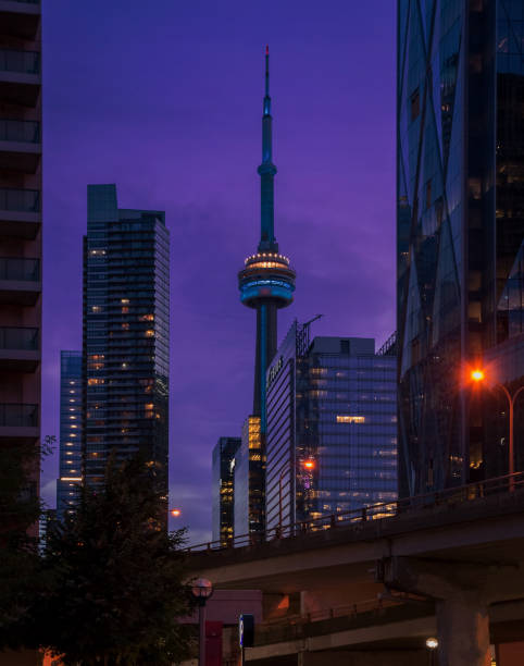 Toronto, Canada - February 9, 2024 : Vibrant colors in the clouds over the Toronto Skyline at sunset, seen from Polson Pier