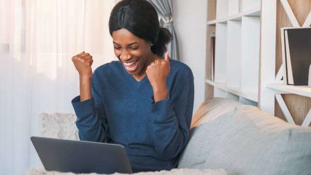 istock Online win internet lottery woman laptop home 2021350138