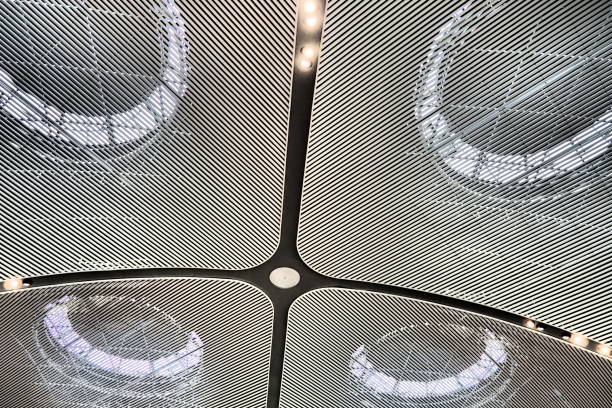 An upward view of the impressive glass and steel dome of the Center Potsdamer Platz (formerly known as the Sony Center) in Berlin, Germany. The architectural structure, inspired by Mount Fuji, features radial steel beams and translucent fabric panels that create a striking modern canopy over the central plaza.