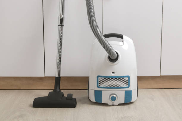 Modern vacuum cleaner on white background