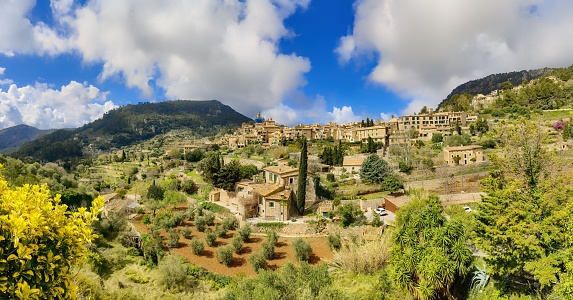 View of a hillside village bathed in sunlight in Majorca