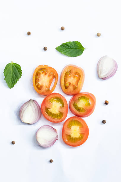 Fresh tomatoes and onions, and spices isolated on white background, top view