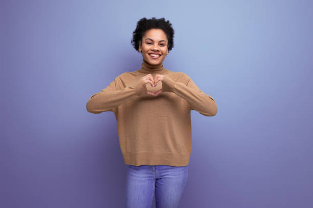 istock young attractive latin woman with black afro hair pulled back in ponytail isolated on background with copy space 2021388933