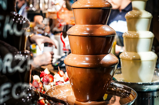 Chocolate fondue. Sweet dessert. Close up.