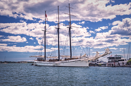 Toronto, Ontario, Canada - 2019 06 30: One of the most popular Toronto s attractions Empire Sandy tall ship beside the pier in Toronto Harboufront. Classic schooner provides chartered tours for the public from Toronto, Canada