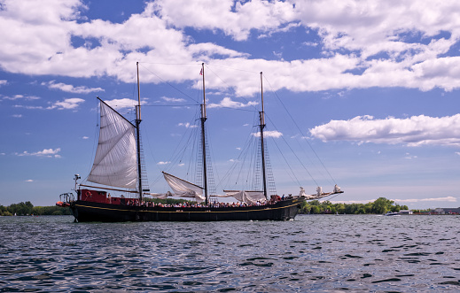 Toronto, Ontario, Canada - 2019 06 30: Kajama tall ship in the waters of Toronto Harbour. Kajama is a three-masted former cargo schooner, that currently operates on Lake Ontario as a cruise ship