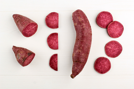 Purple Red Japanese Sweet Potato in Various Slice, over White Background