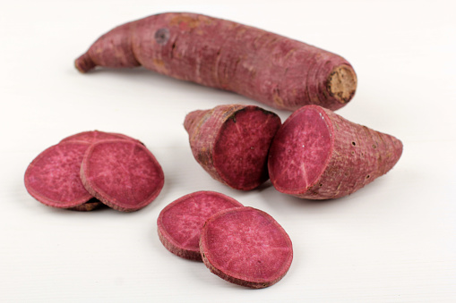 Purple Red Japanese Sweet Potato in Various Slice, over White Background. Isolated Picture of Fresh Ingredient