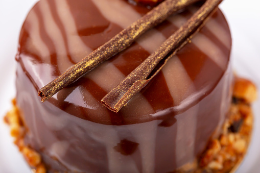Fresh delicious chocolate souffle cake close-up. Caramel glaze and decoration add appeal and desire