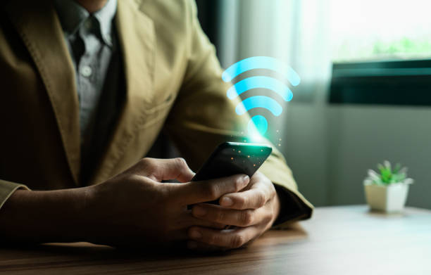 istock Wifi internet access concept, Business people connect WiFi technology. connect instantly via smartphone and high-speed hotspot. Fast internet wifi hotspot sharing. Working with various applications 2021524268