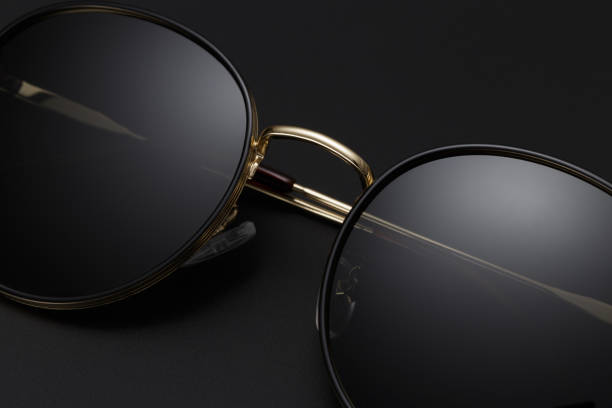 istock Women's luxury sunglasses isolated on black background 2021635044