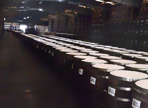 Factory Products on Display, Barrels in a Row in a Warehouse,