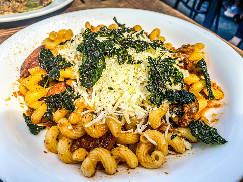 Curly noodles, spinach and Italian flavors creates a delicious dish.
