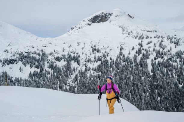 istock Backcountry skier climbing mountain 2021826746