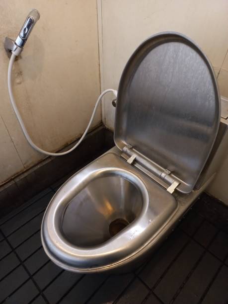 wc in acciaio inox - bathroom water pipe faucet sink foto e immagini stock