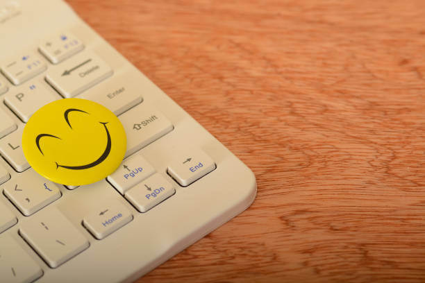istock a smile sign into a computer keyword could symbolize a focus on customer satisfaction and user-friendly design, reflecting a commitment to a positive digital experience. 2021904201
