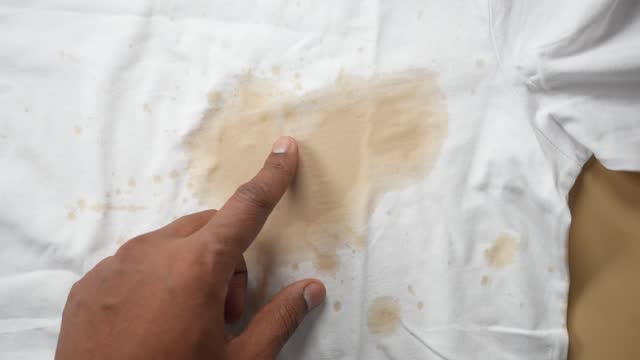 spilled coffee on a white shirt
