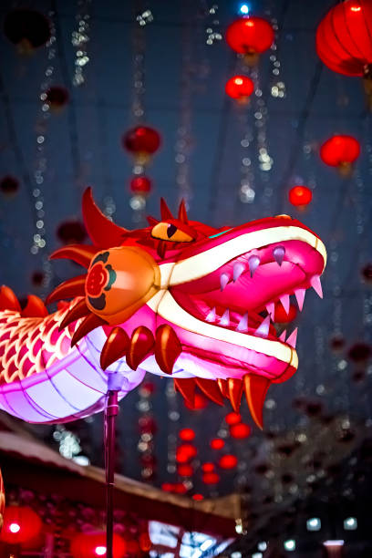 istock Red dragon in Chinese New Year. Evening festive illumination 2021947180