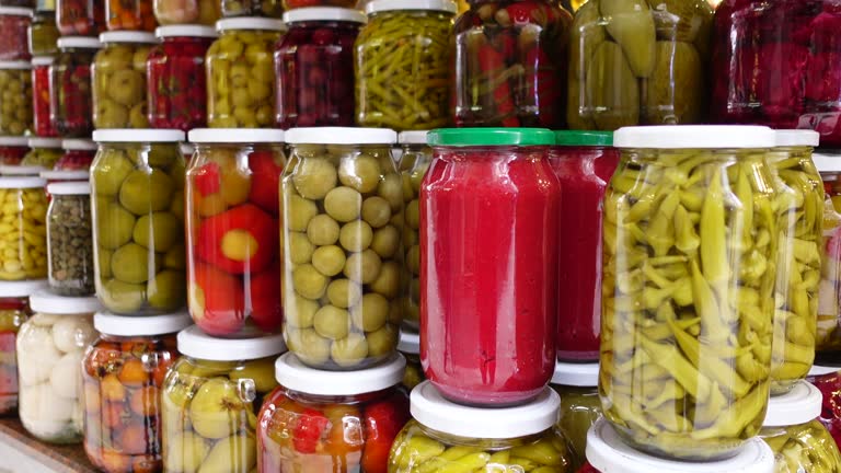 Canned fruits and vegetables in glass jars