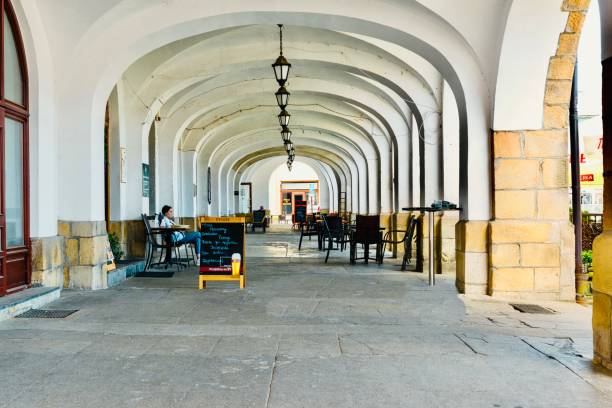 Krosno, Poland - June 12, 2022: The market square  is surrounded by architectural structures of different styles and eras. Restored buildings with beautiful arcade arches create a unique  atmosphere.