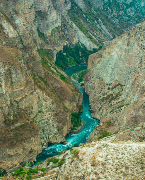 istock Mountain river flowing along the bottom of a deep canyon 2021990593