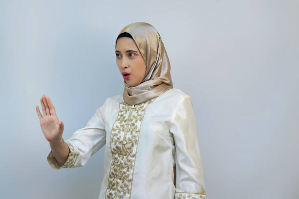istock Young Muslim woman posing in White background studio for Ramadan or Eid Concept 2021999068