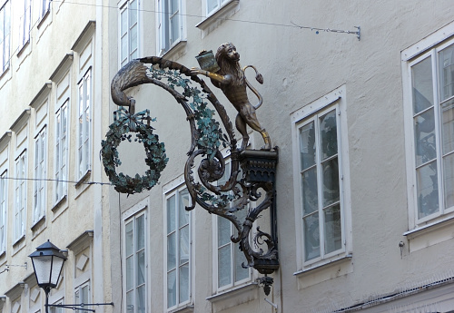 Salzburg, Austria - 13 January 2024: Guild sign in the historic city center of Salzburg, Austria.