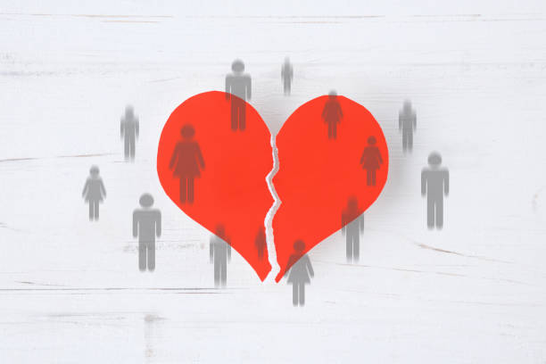istock Broken heart with human pictograms appearing and disappearing at random 2022036615