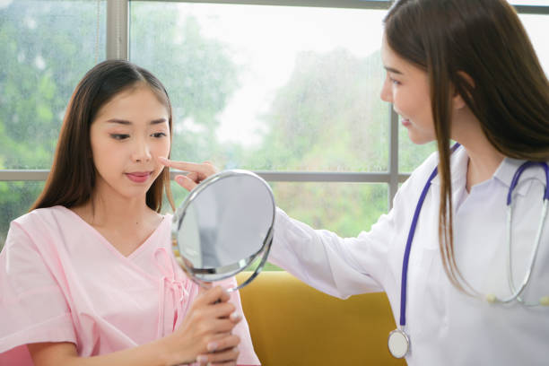 istock A beauty doctor explains cosmetic surgery and post-operative care. 2022040779