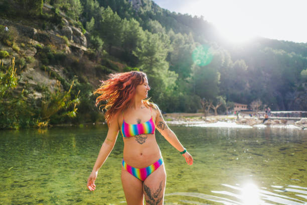 istock Joyful woman in vibrant bikini 2022047023