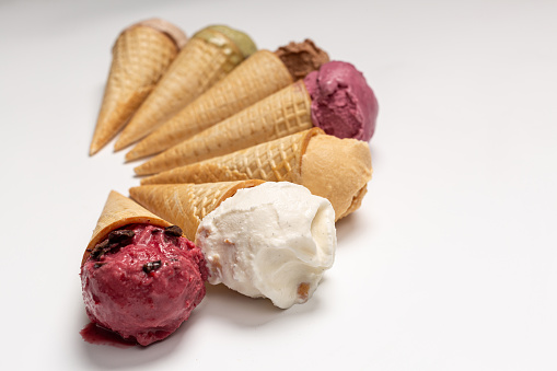 Ice cream cones of different flavors, assorted, homemade natural ice cream, white background