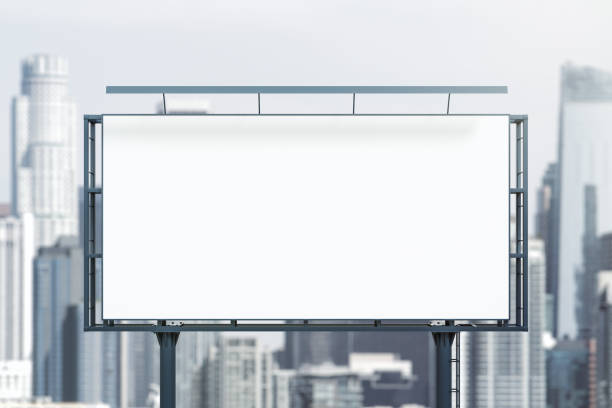istock Blank white horizontal billboard on cityscape background at daytime, front view. Mockup, advertising concept 2022061044