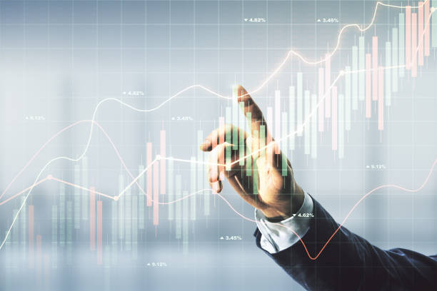 istock Multi exposure of man hand with pen working with abstract virtual financial graph on blurred office background, forex and investment concept 2022061569