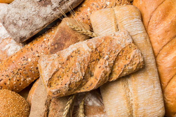 istock Homemade natural breads. Different kinds of fresh bread as background, top view with copy space 2022085558