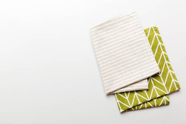 istock top view with gray kitchen napkin isolated on table background. Folded cloth for mockup with copy space, Flat lay. Minimal style 2022086147