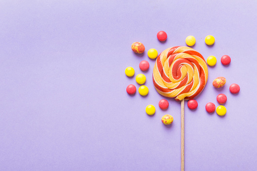 Set of colorful lollipops on colored background. Summer concept. Party Happy Birthday or Minimalist Concept.