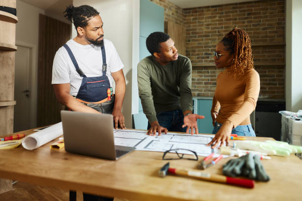 istock Black couple talking about problems with manual worker in the apartment. 2022095092