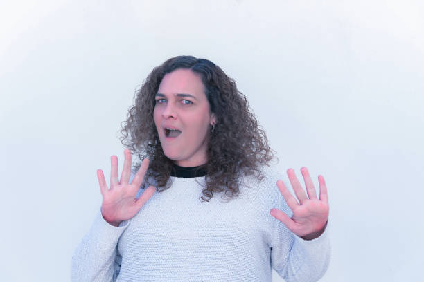 istock curly-haired blonde woman with a surprised gesture 2022100452