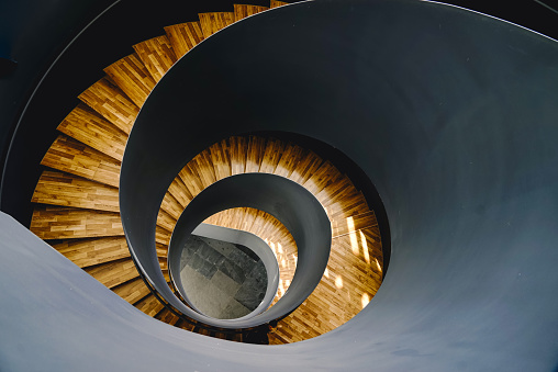 Looking down at the grey spiral staircase