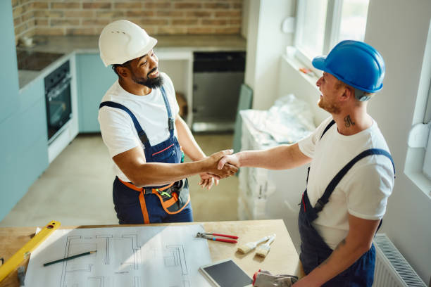istock Happy manual workers came to an agreement in moving apartment. 2022106351