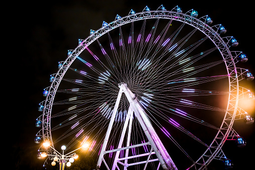 The smiling Ferris wheel in the night sky