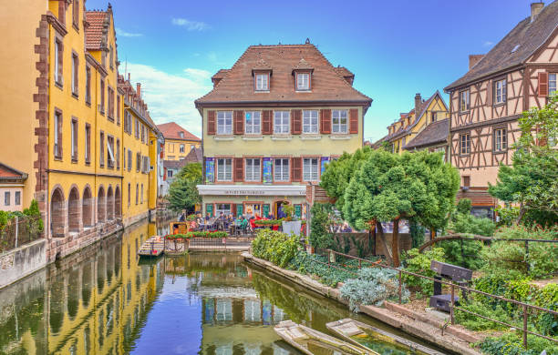 Colmar, France - September 20, 2022: Little Venice district, a bar with boats for tourists, along the Lauch river