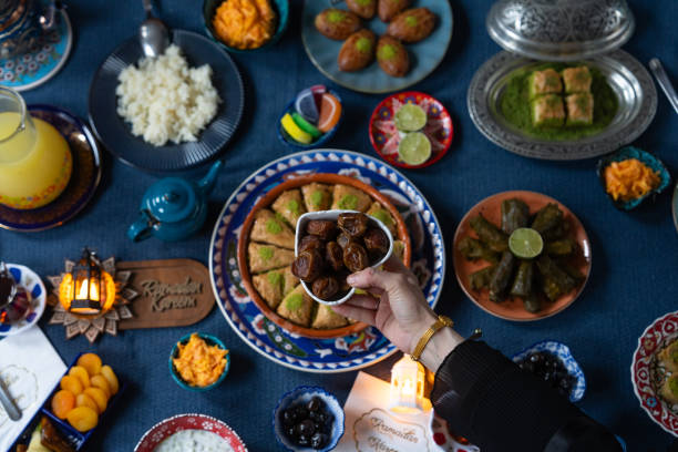 istock Ramadan Iftar Table. Muslim Family Having Dinner At Home. Iftar Table with Traditional Food. Fasting ends with Dates and Turkish Pide. Ramadan Feast Celebrations, Eid Mubarak Concept Uskudar Istanbul, Turkiye (Turkey) 2022124380