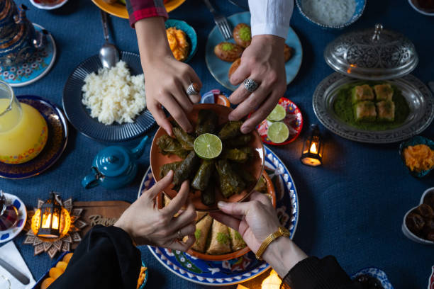 istock Ramadan Iftar Table. Muslim Family Having Dinner At Home. Iftar Table with Traditional Food. Fasting ends with Dates and Turkish Pide. Ramadan Feast Celebrations, Eid Mubarak Concept Uskudar Istanbul, Turkiye (Turkey) 2022126475