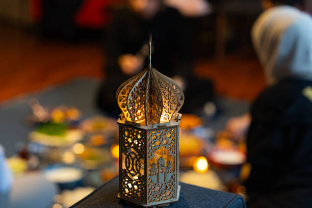 Ramadan Iftar Table. Muslim Family Having Dinner At Home. Iftar Table with Traditional Food. Fasting ends with Dates and Turkish Pide. Ramadan Feast Celebrations, Eid Mubarak Concept Uskudar Istanbul, Turkiye (Turkey) stock photo