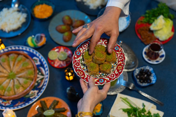 istock Ramadan Iftar Table. Muslim Family Having Dinner At Home. Iftar Table with Traditional Food. Fasting ends with Dates and Turkish Pide. Ramadan Feast Celebrations, Eid Mubarak Concept Uskudar Istanbul, Turkiye (Turkey) 2022138176