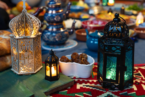 Ramadan Iftar Table. Muslim Family Having Dinner At Home. Iftar Table with Traditional Food. Fasting ends with Dates and Turkish Pide. Ramadan Feast Celebrations, Eid Mubarak Concept Uskudar Istanbul, Turkiye (Turkey)
