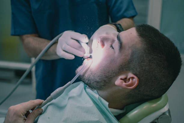 istock the dentist grinds the patient's teeth with a turbine 2022158675